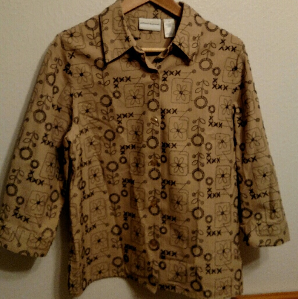 Tan and black embroidered button down shirt.